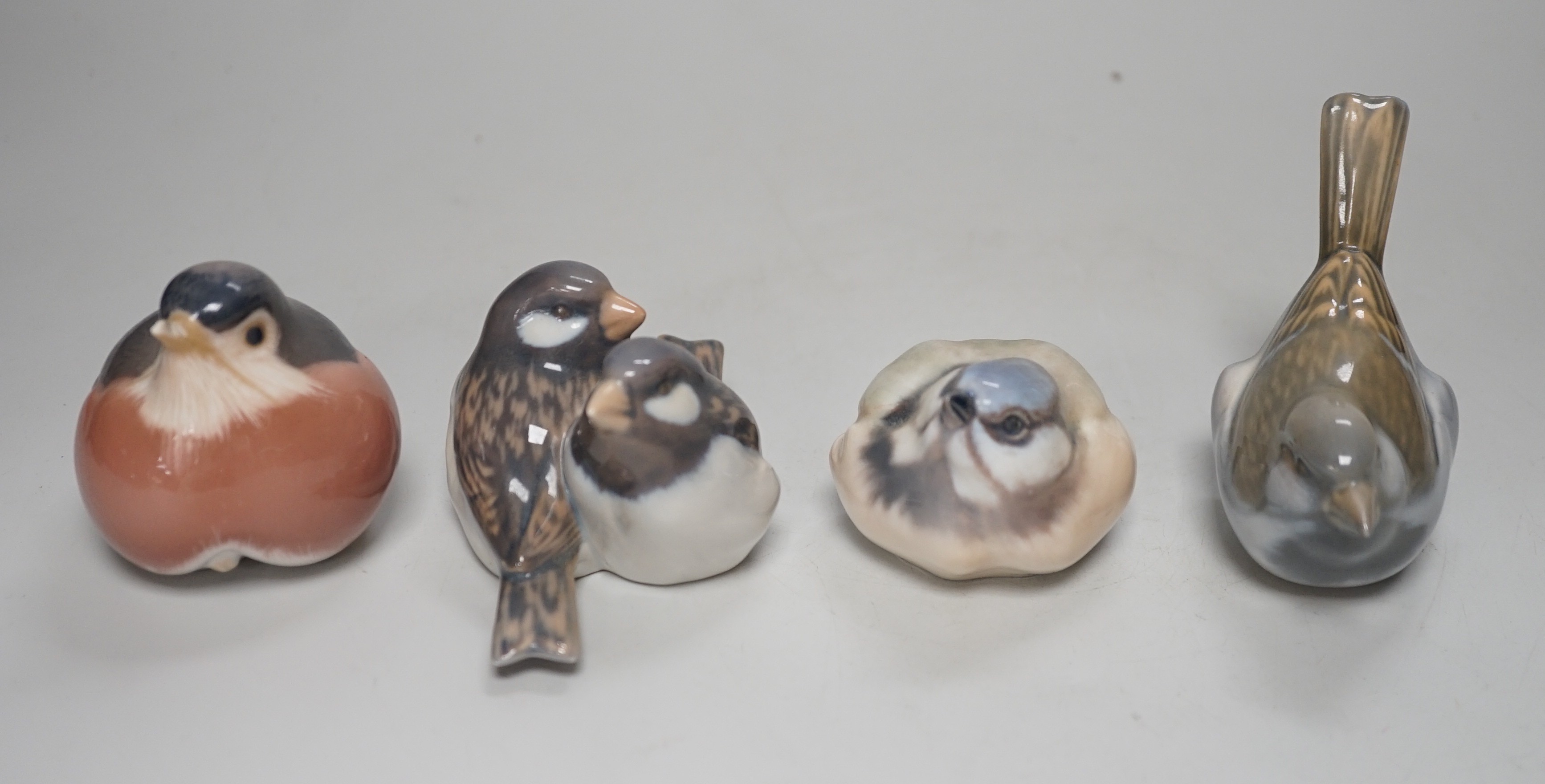 Four Copenhagen models of birds. Tallest 8cm
